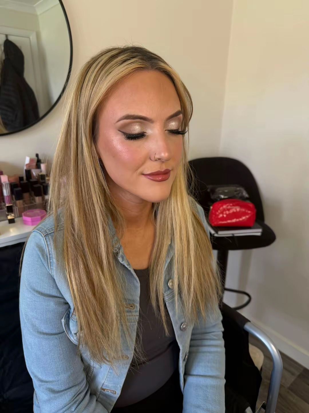 Soft glam makeup with glowing skin and curled hair