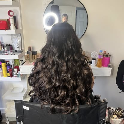 Long curled hair styled from the back