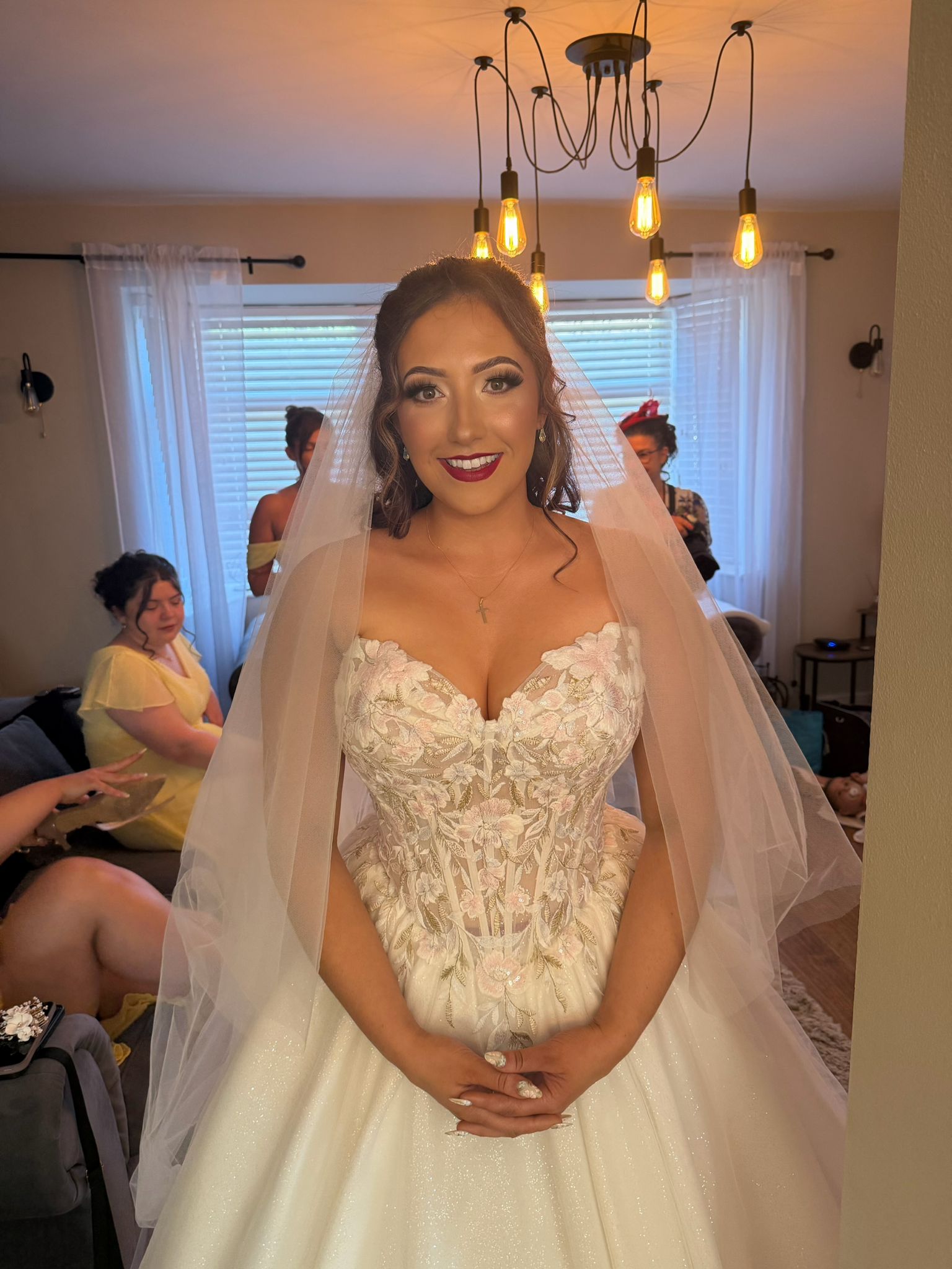 Bride in veil with finished bridal makeup